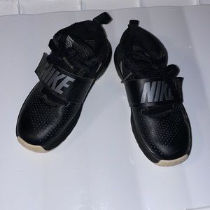 Nike team hustle, size 13, black with silver shoes